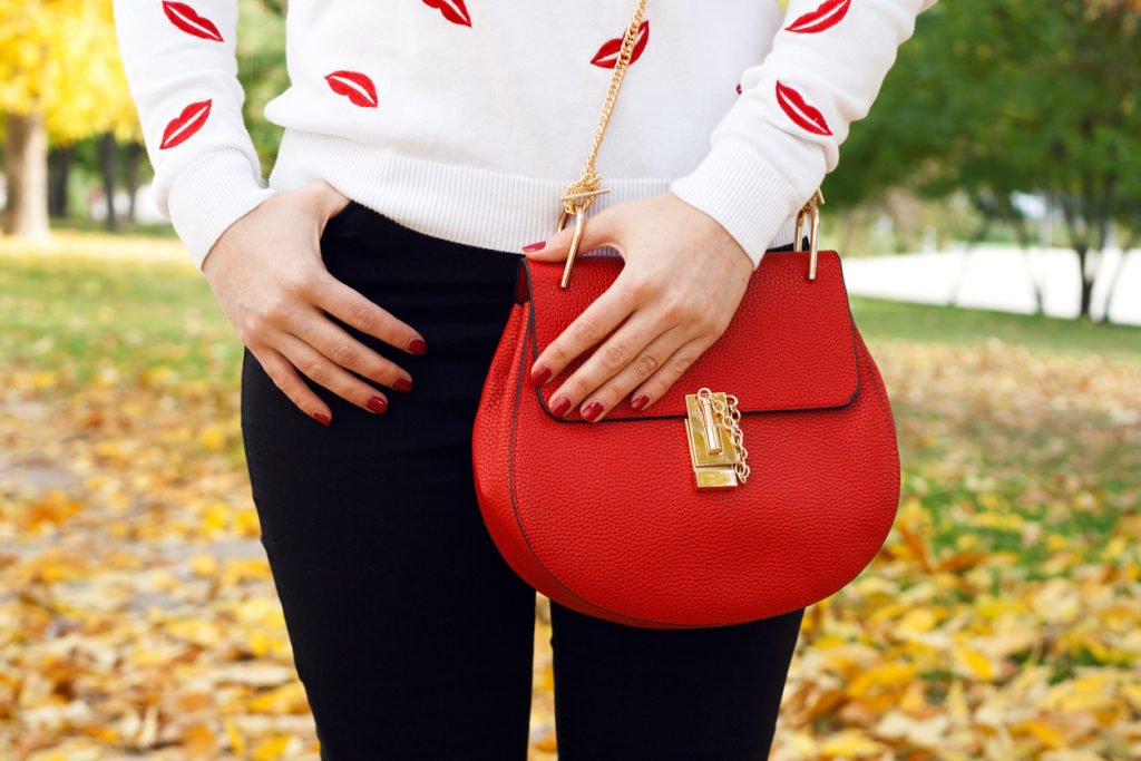Girl with red handbag