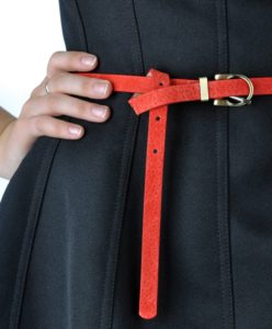 woman wearing black dress with red belt