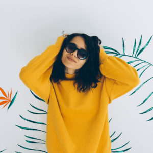 Girl in oversized sweater and sunglasses