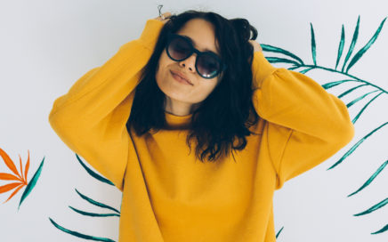 Girl in oversized sweater and sunglasses