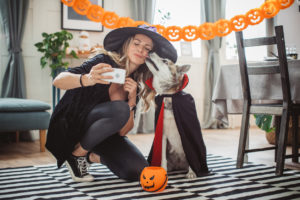 Woman taking selfie in Halloween costume