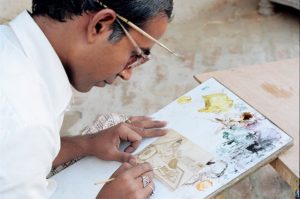 Indian artist working on a sketch